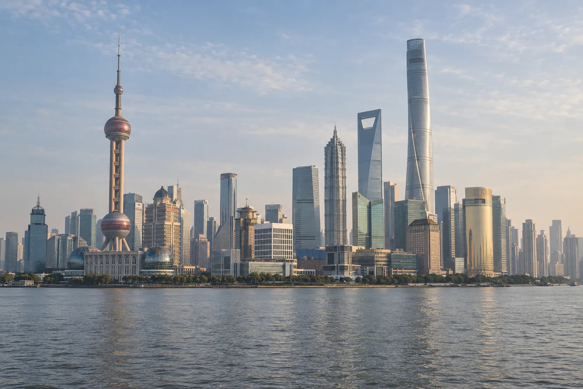Shanghai’s modern Lujiazui skyline across the Huangpu River in soft morning light